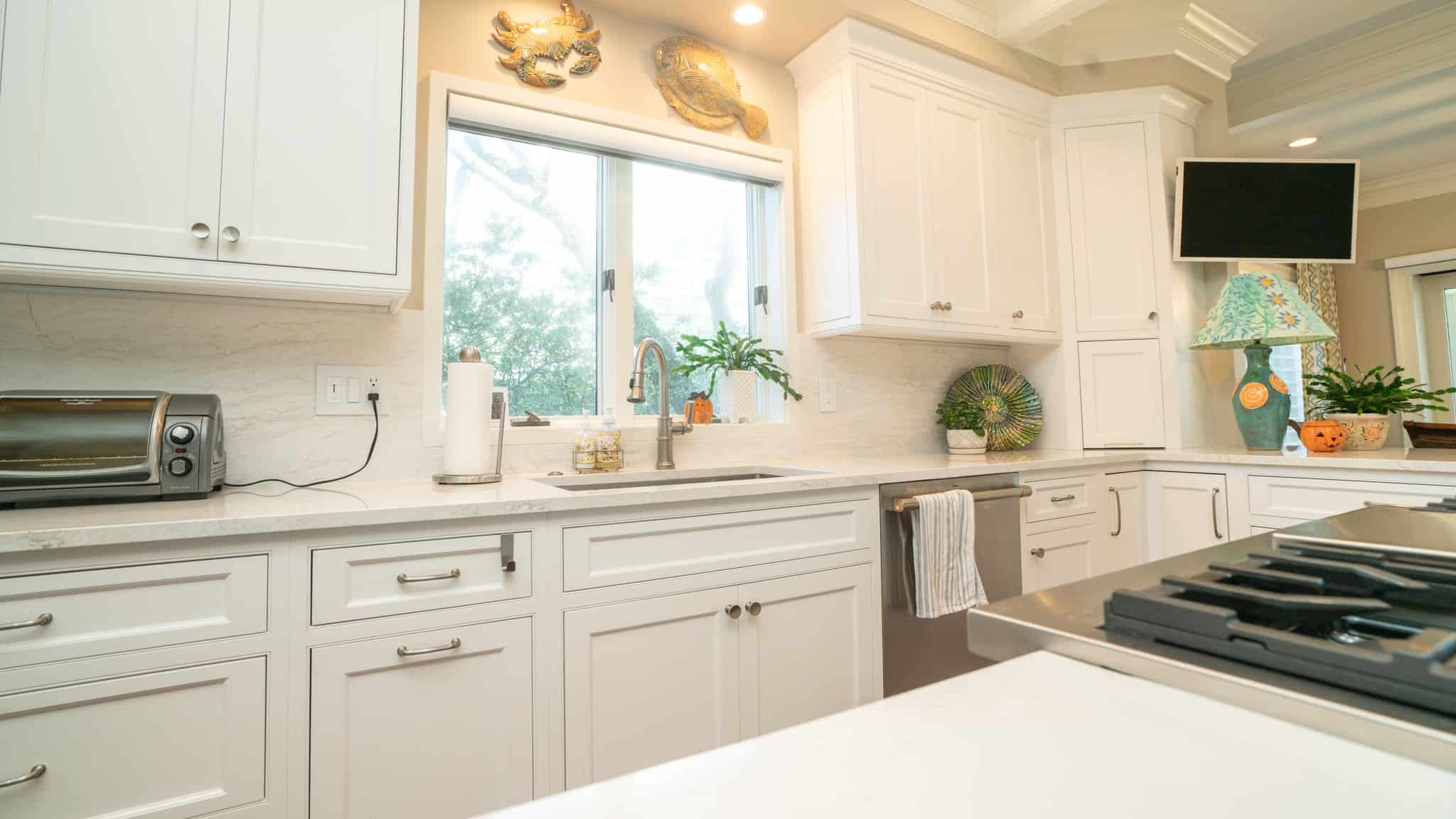 Modern kitchen with custom cabinetry, quartz counters, and high-end appliances