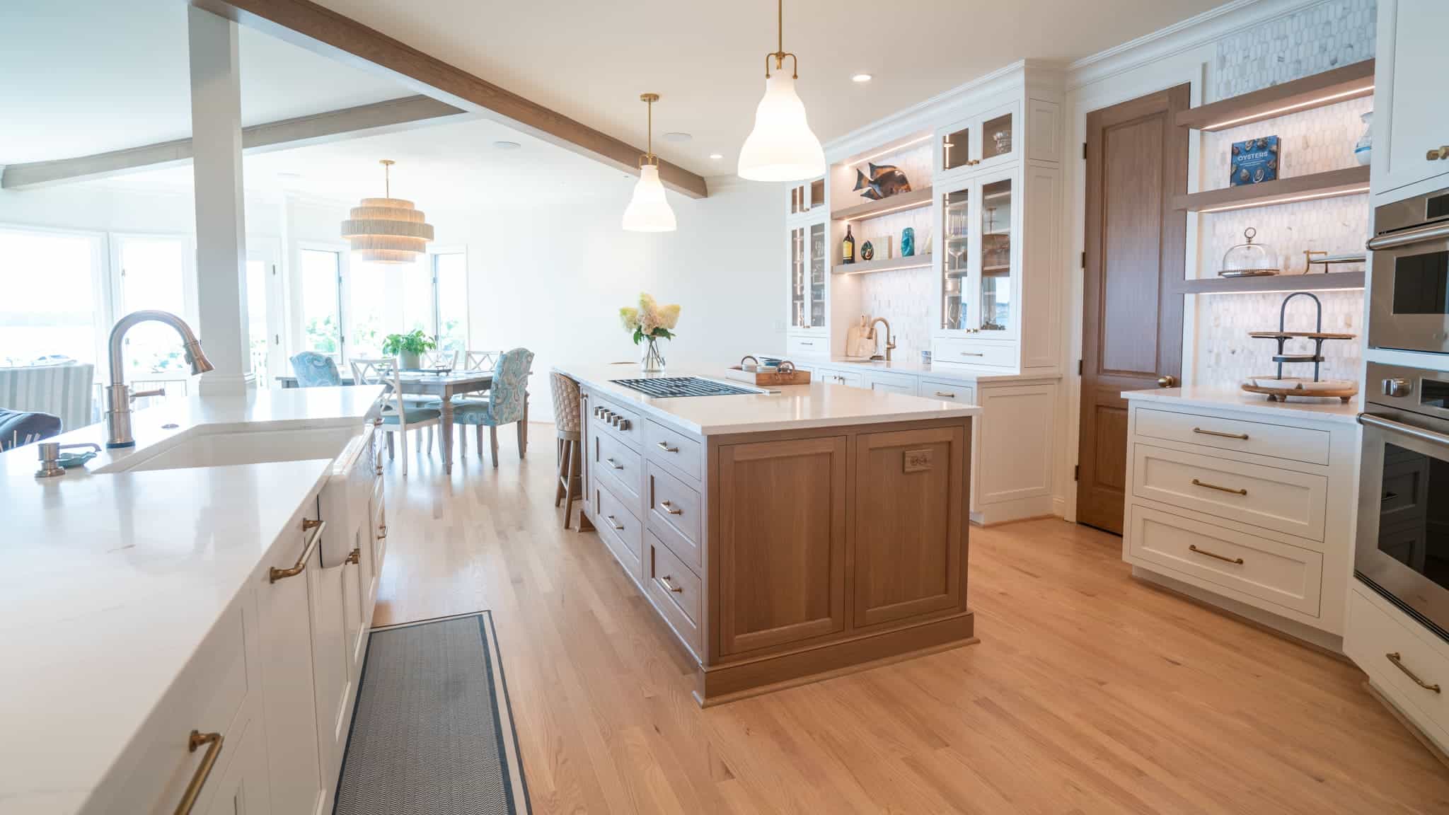 Open-concept living with floor-to-ceiling Broad Bay views