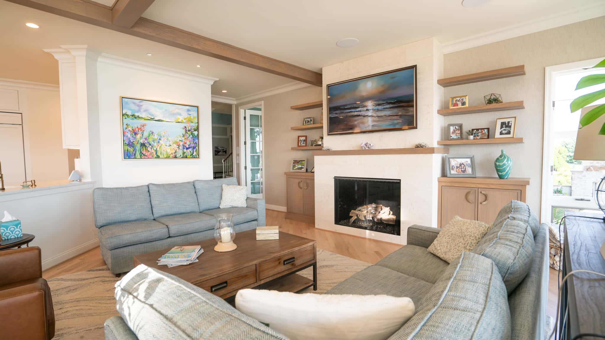 Coastal-inspired architecture with expansive porches and large waterfront windows